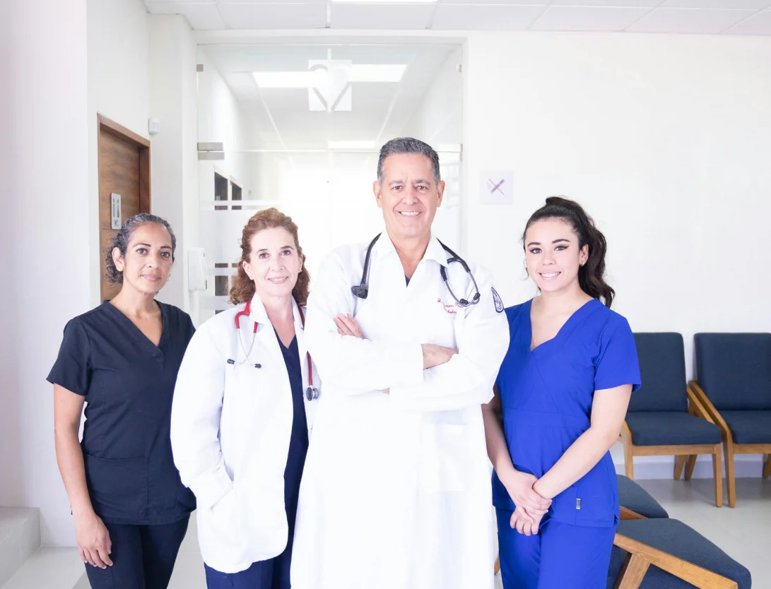 Dentists and dental nurses smiling in a clinic